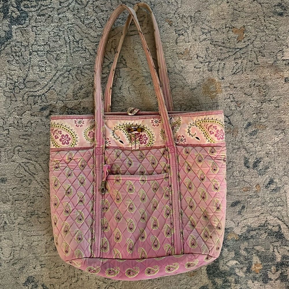 Gently used Vera Bradley vintage patterned tote bag. Pockets on each side.